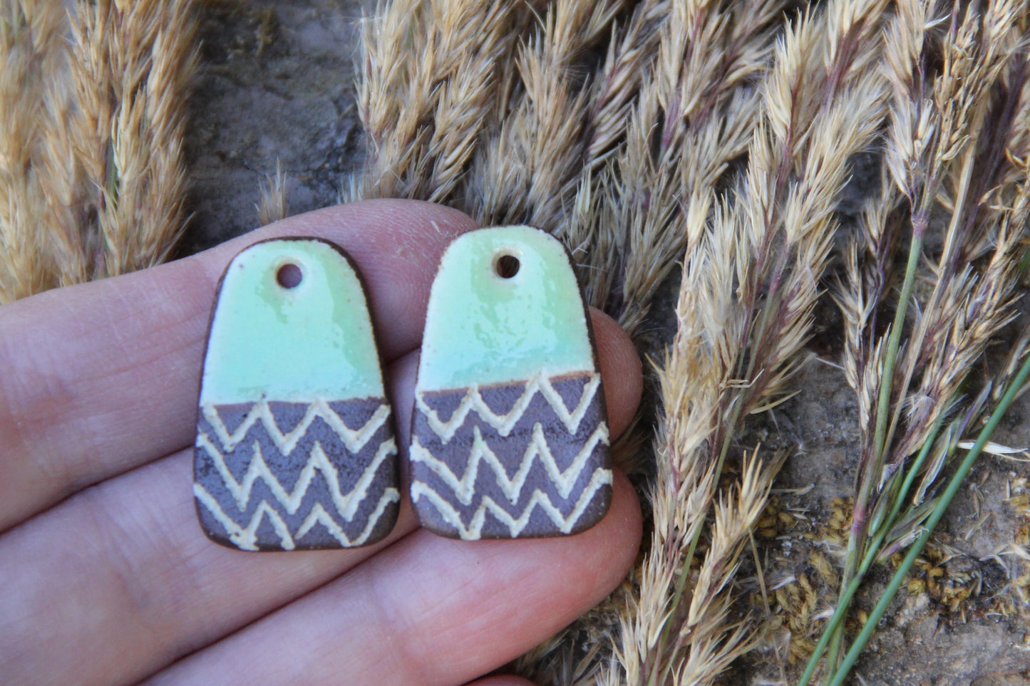 A pair of rustic flat ceramic earring dangles