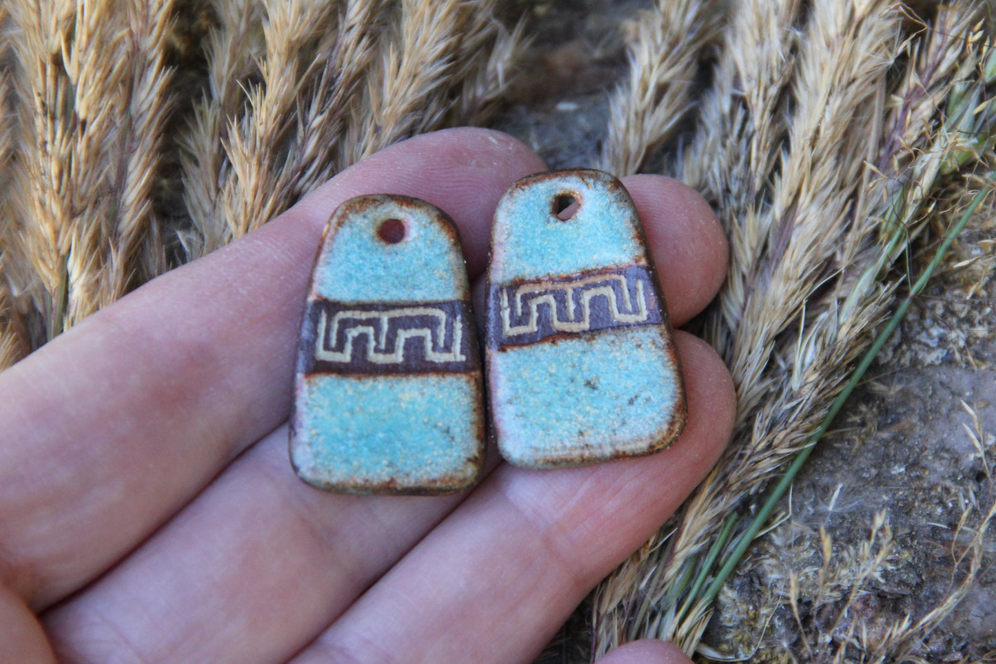 A pair of rustic flat ceramic earring dangles