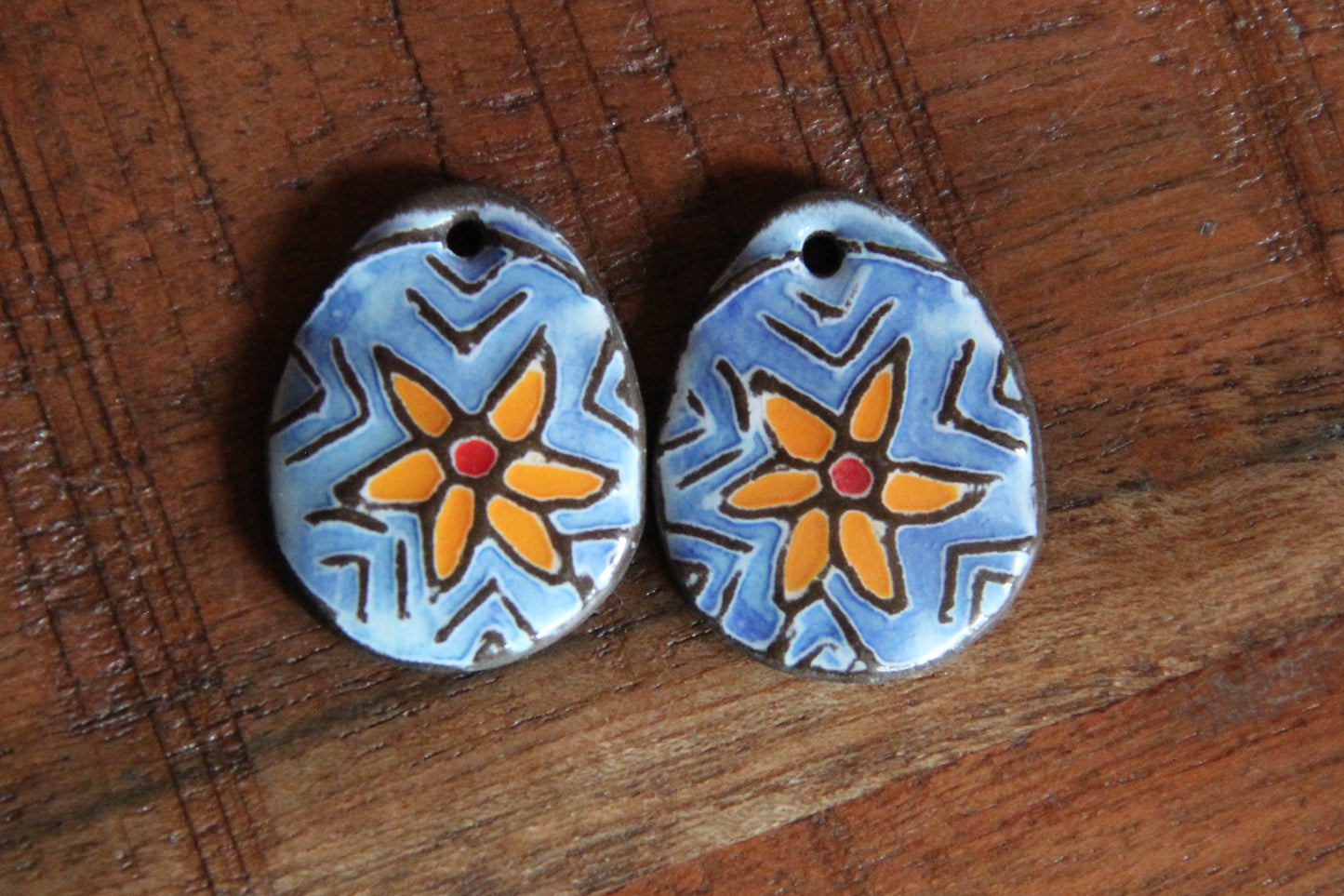 A pair of STAR FLOWER ceramic earring dangles