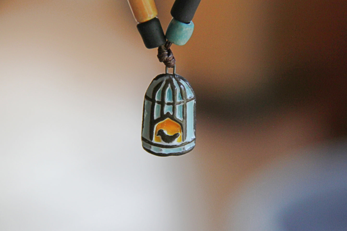 CALM - Bracelet set with a charm BIRD WITH CAGE DOOR OPENED