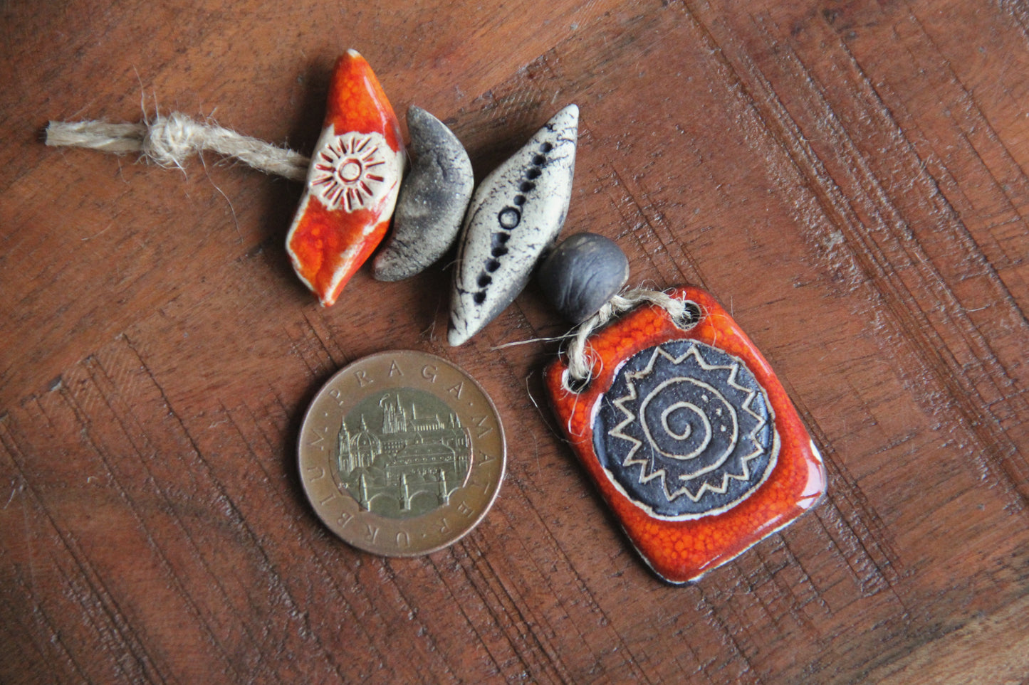 Spiral sun small pendant set with beads