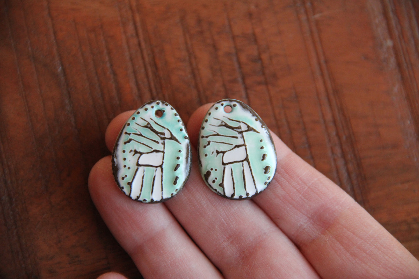 A pair of ceramic earring dangles