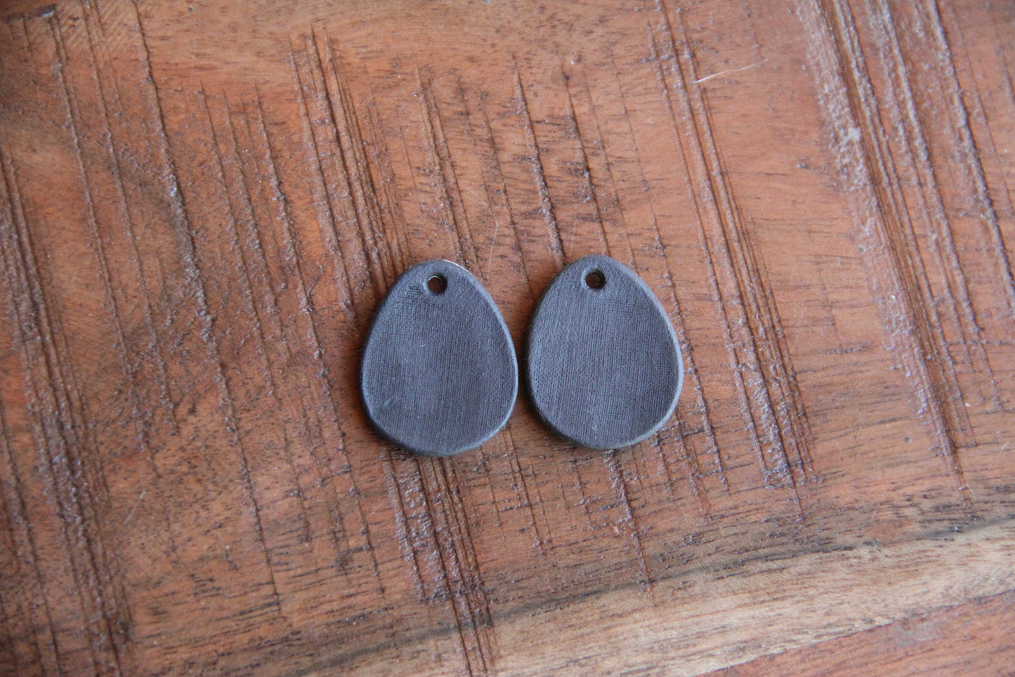 A pair of ceramic earring dangles