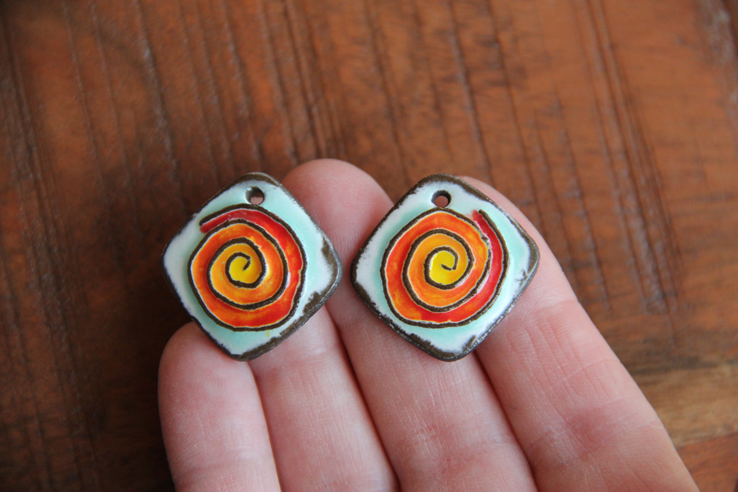 A pair of SPIRAL ceramic earring dangles