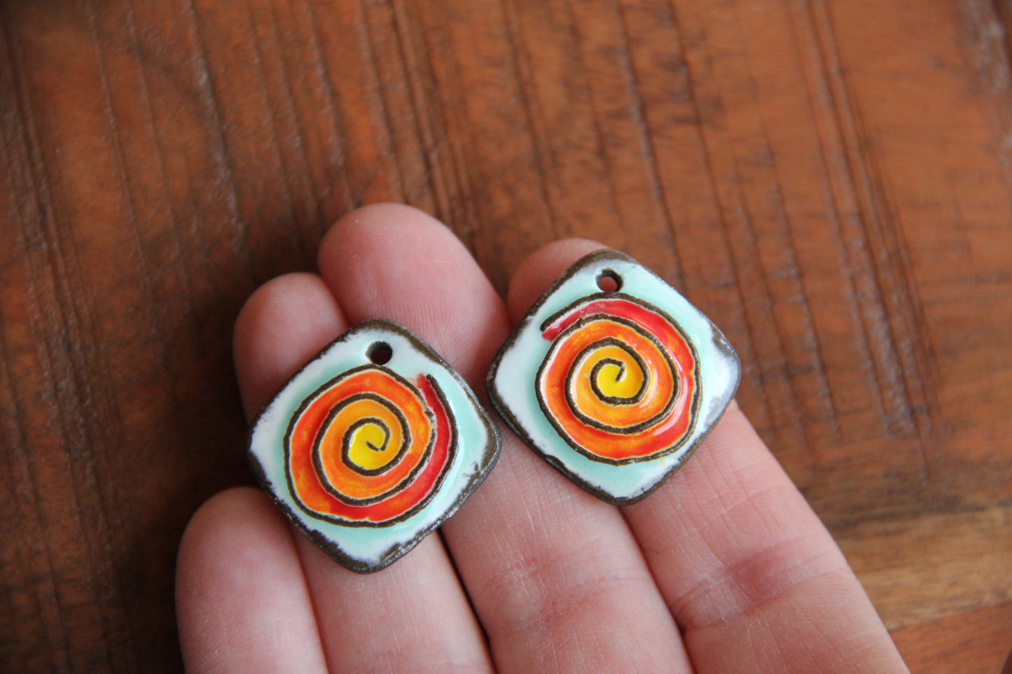 A pair of SPIRAL ceramic earring dangles