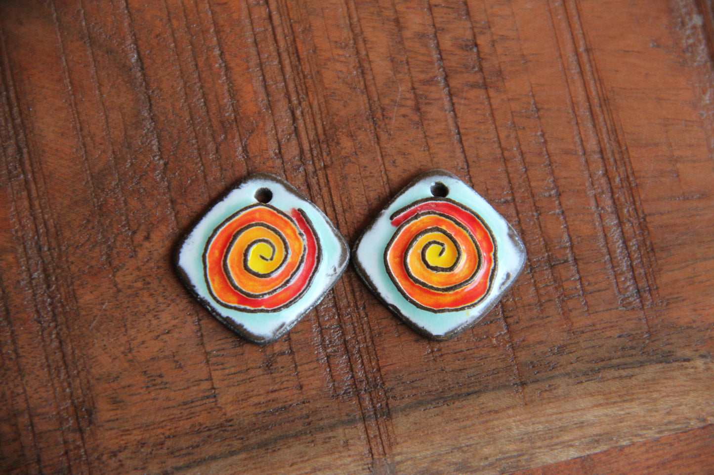 A pair of SPIRAL ceramic earring dangles