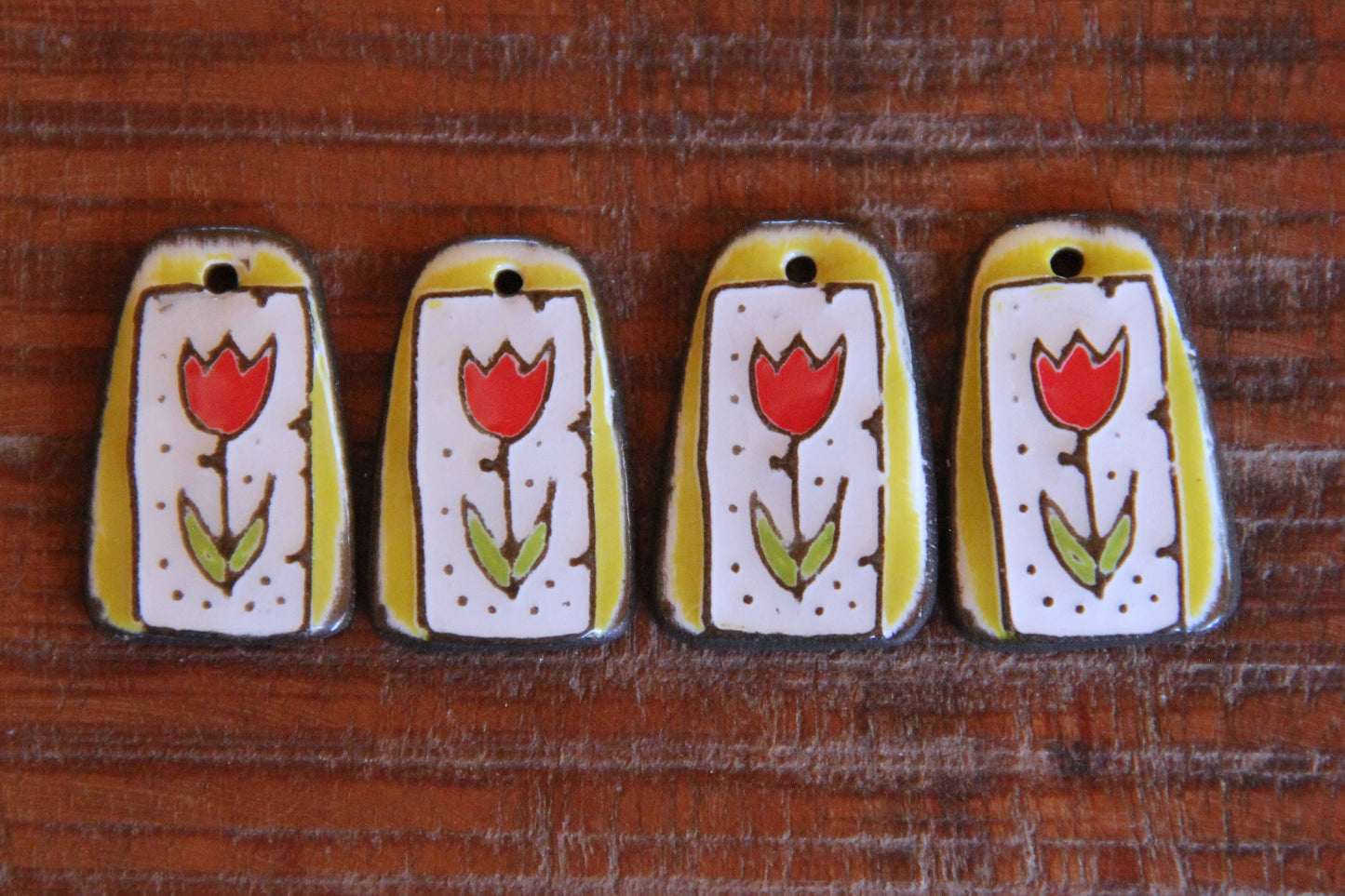 A pair of TULIPS ceramic earring dangles