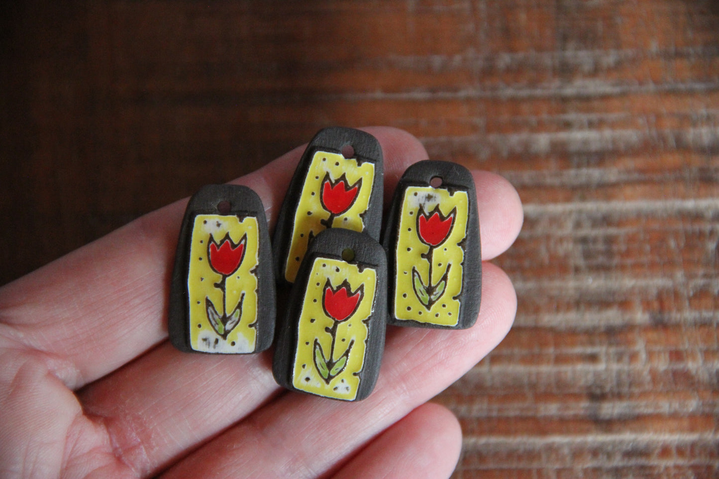 A pair of TULIPS ceramic earring dangles