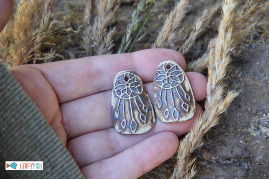 A pair of DREAMCHATCHERS ceramic earring dangles