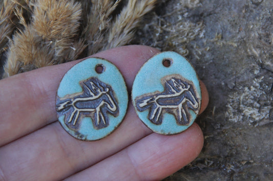A pair of rustic horse ceramic earring dangles