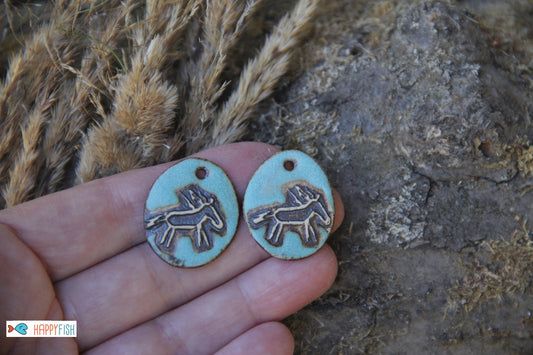 A pair of rustic horse ceramic earring dangles