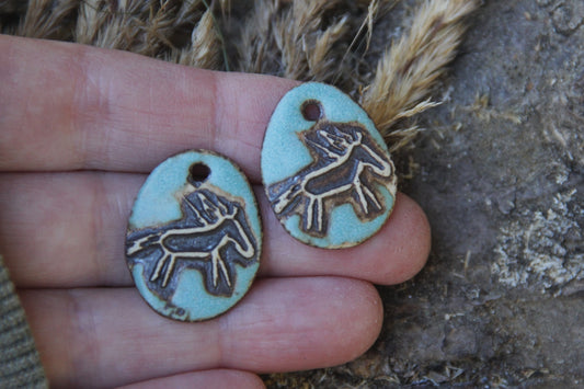 A pair of rustic horse ceramic earring dangles