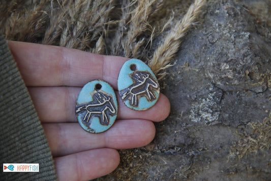 A pair of rustic horse ceramic earring dangles