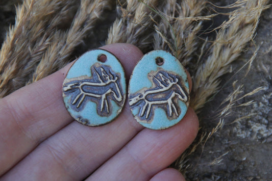 A pair of rustic horse ceramic earring dangles
