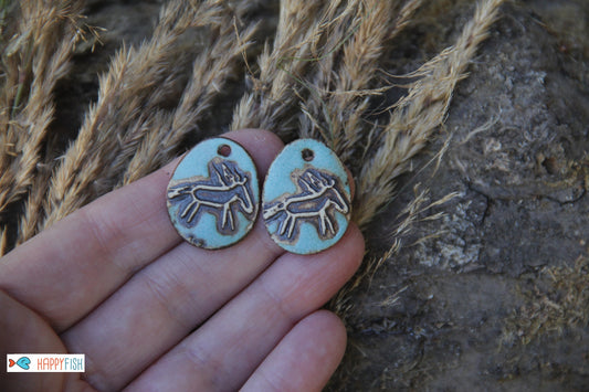 A pair of rustic horse ceramic earring dangles