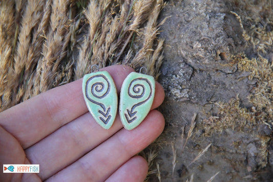 A pair of rustic flat ceramic earring dangles