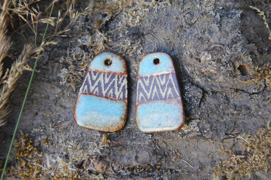 A pair of rustic flat ceramic earring dangles