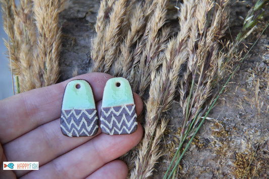 A pair of rustic flat ceramic earring dangles