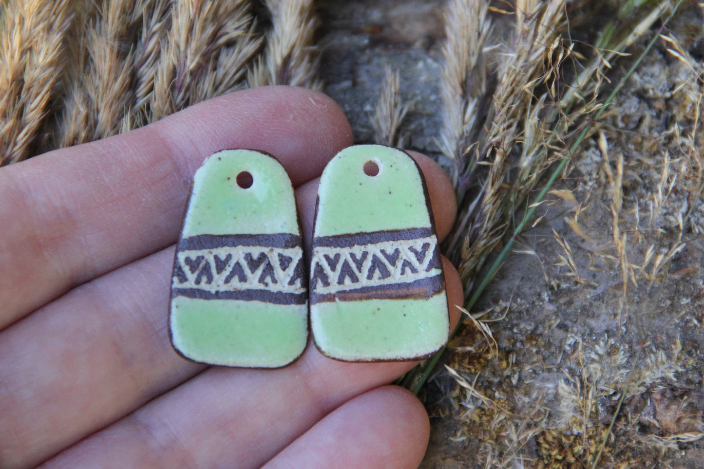 A pair of rustic flat ceramic earring dangles
