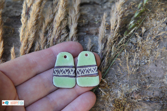 A pair of rustic flat ceramic earring dangles