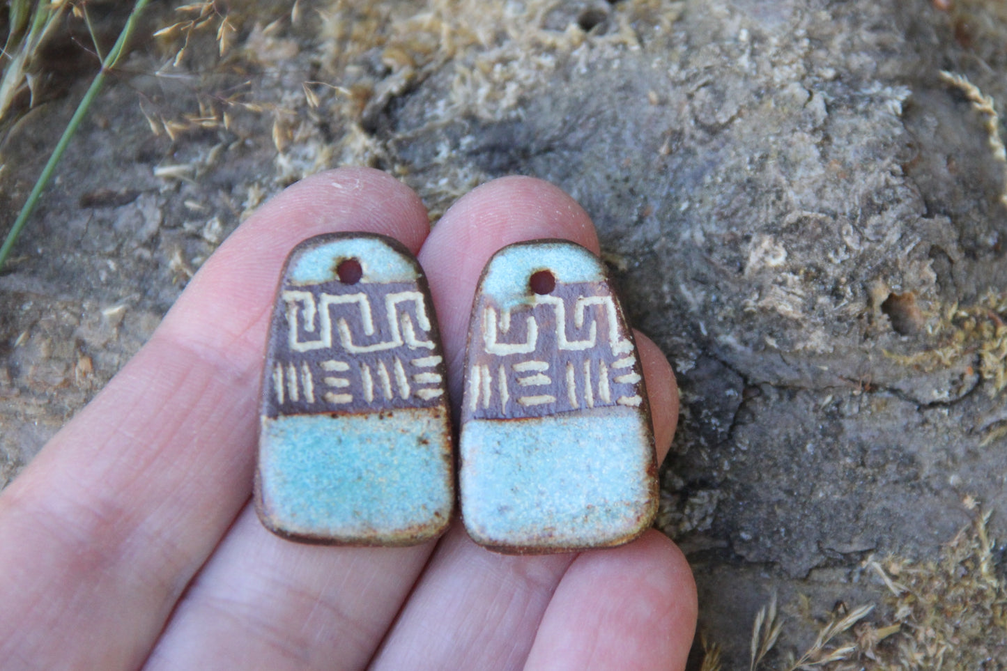 A pair of rustic flat ceramic earring dangles