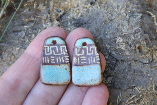 A pair of rustic flat ceramic earring dangles