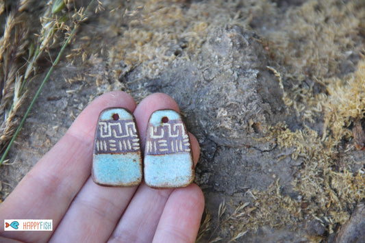 A pair of rustic flat ceramic earring dangles