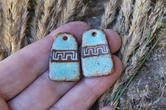 A pair of rustic flat ceramic earring dangles