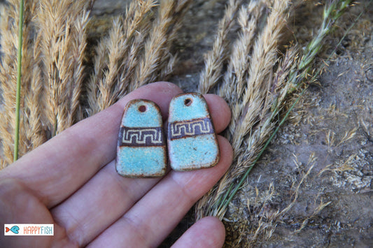 A pair of rustic flat ceramic earring dangles