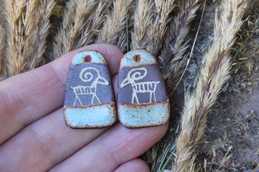 A pair of rustic flat ceramic earring dangles