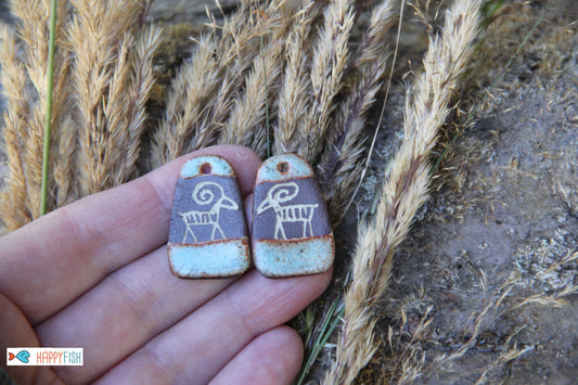A pair of rustic flat ceramic earring dangles