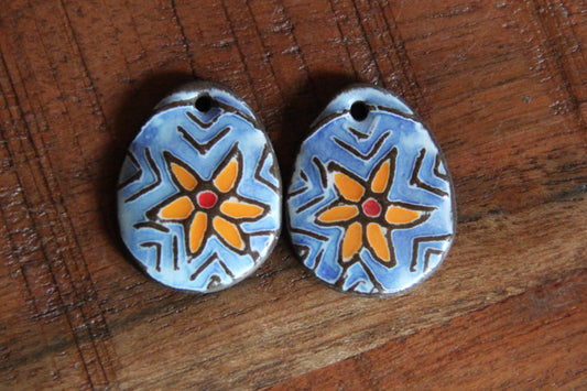 A pair of STAR FLOWER ceramic earring dangles