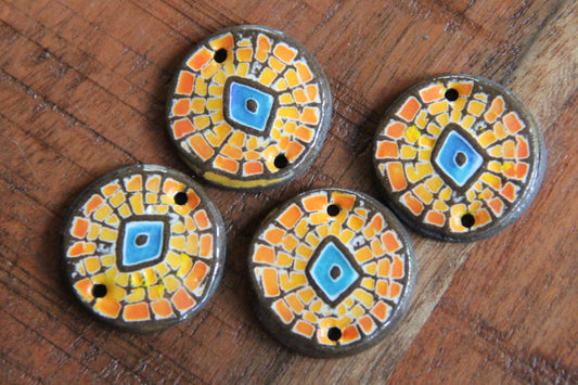 A pair of ceramic CONNECTORS