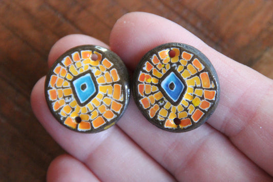 A pair of ceramic CONNECTORS