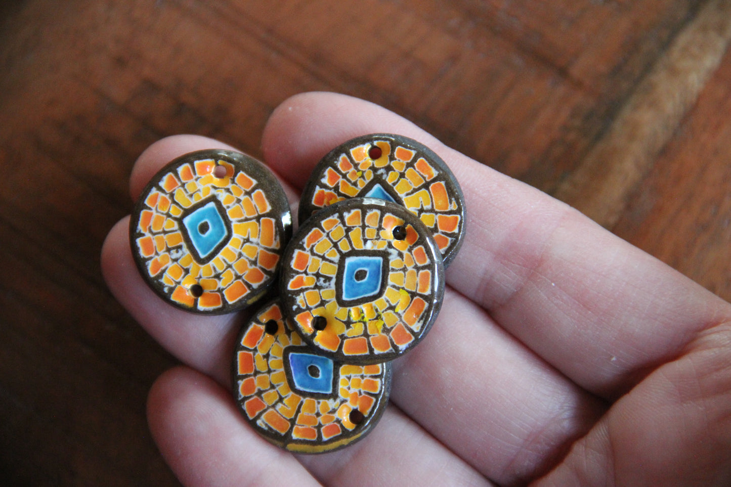 A pair of ceramic CONNECTORS