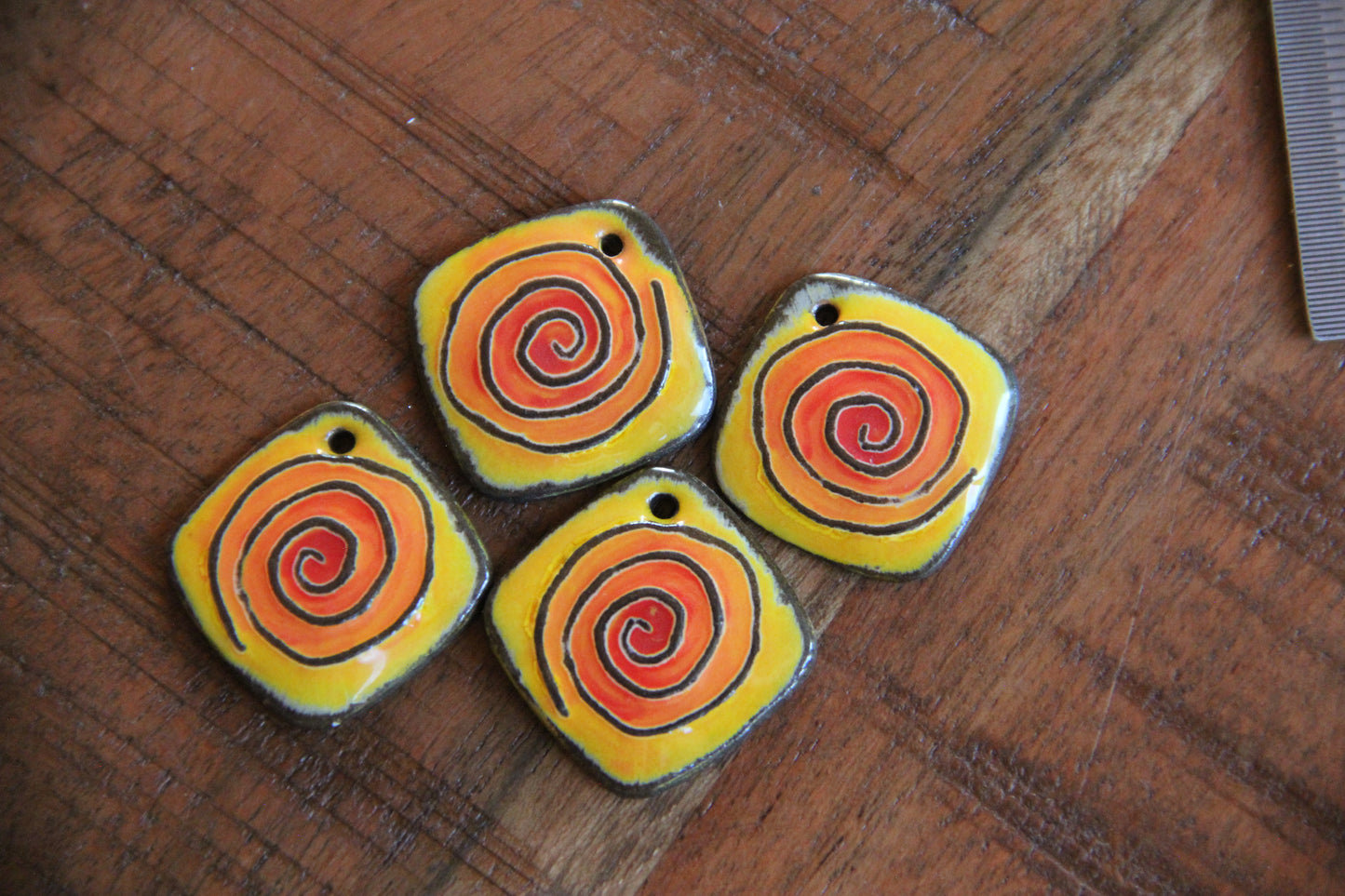 A pair of SPIRAL ceramic earring dangles