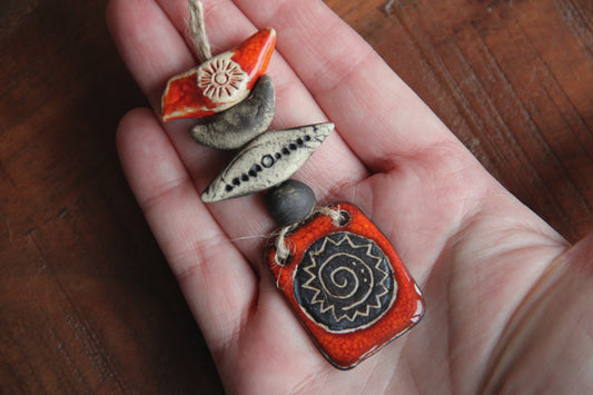 Spiral sun small pendant set with beads