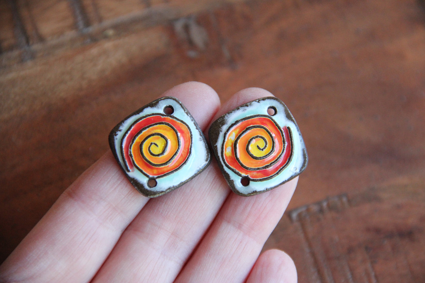 A pair of ceramic SPIRAL CONNECTORS