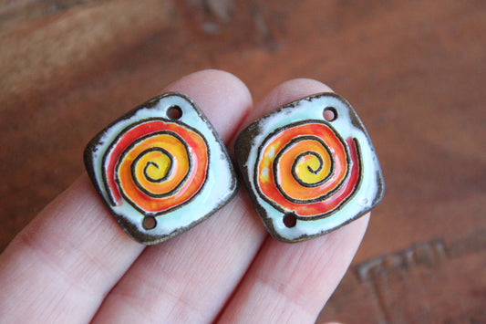 A pair of ceramic SPIRAL CONNECTORS