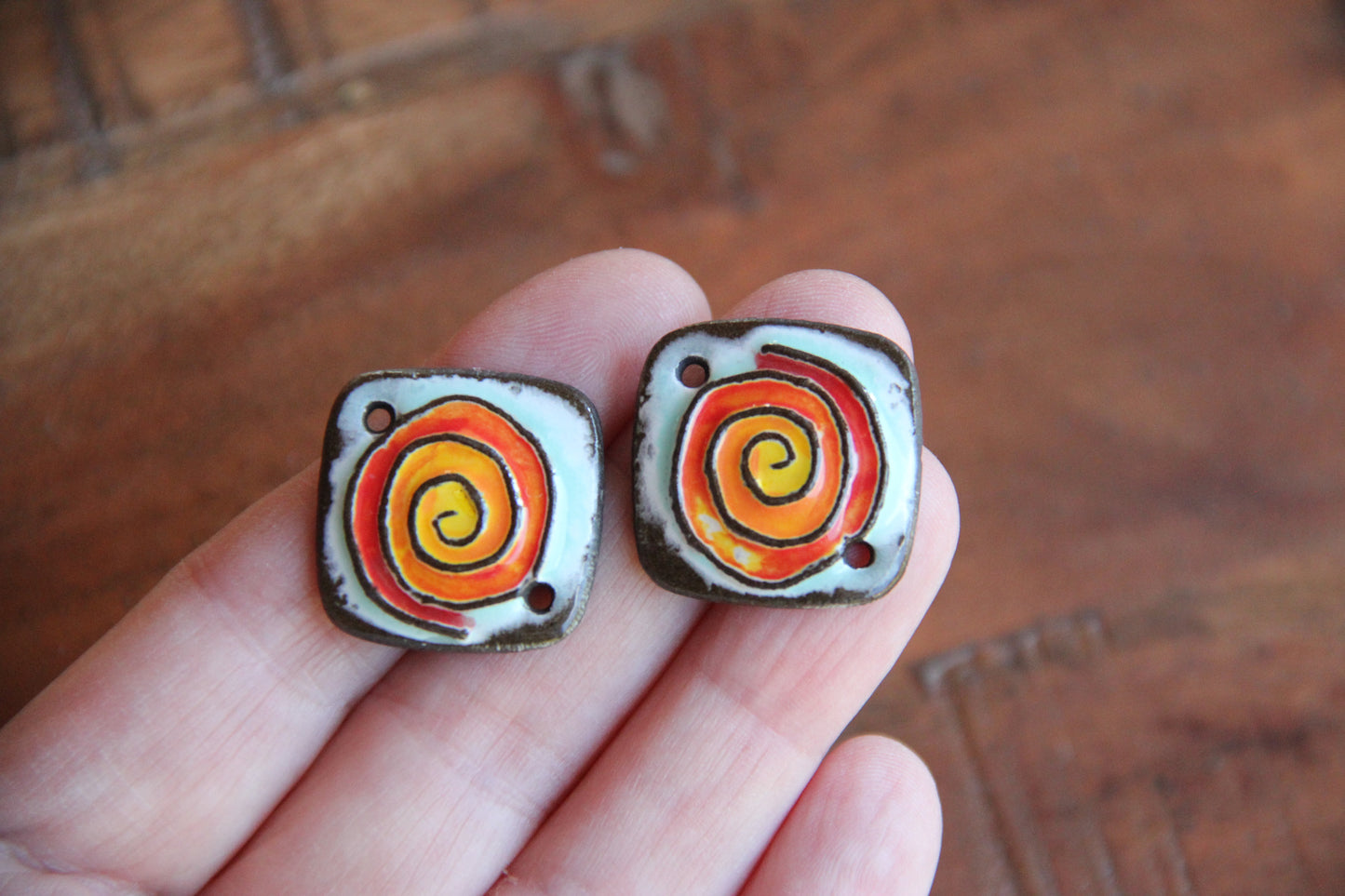 A pair of ceramic SPIRAL CONNECTORS