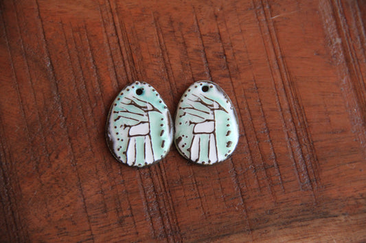 A pair of ceramic earring dangles