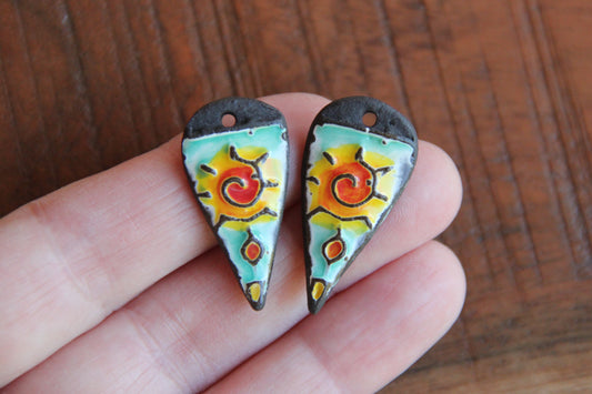 A pair of ceramic earring dangles
