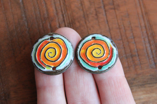 A pair of ceramic SPIRAL CONNECTORS