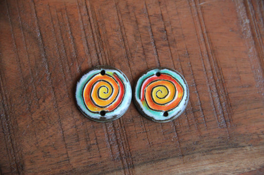 A pair of ceramic SPIRAL CONNECTORS