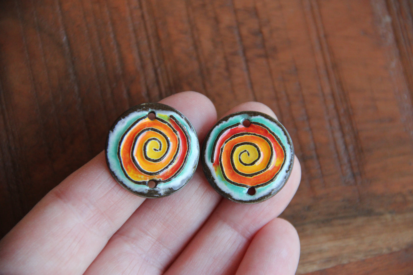 A pair of ceramic SPIRAL CONNECTORS