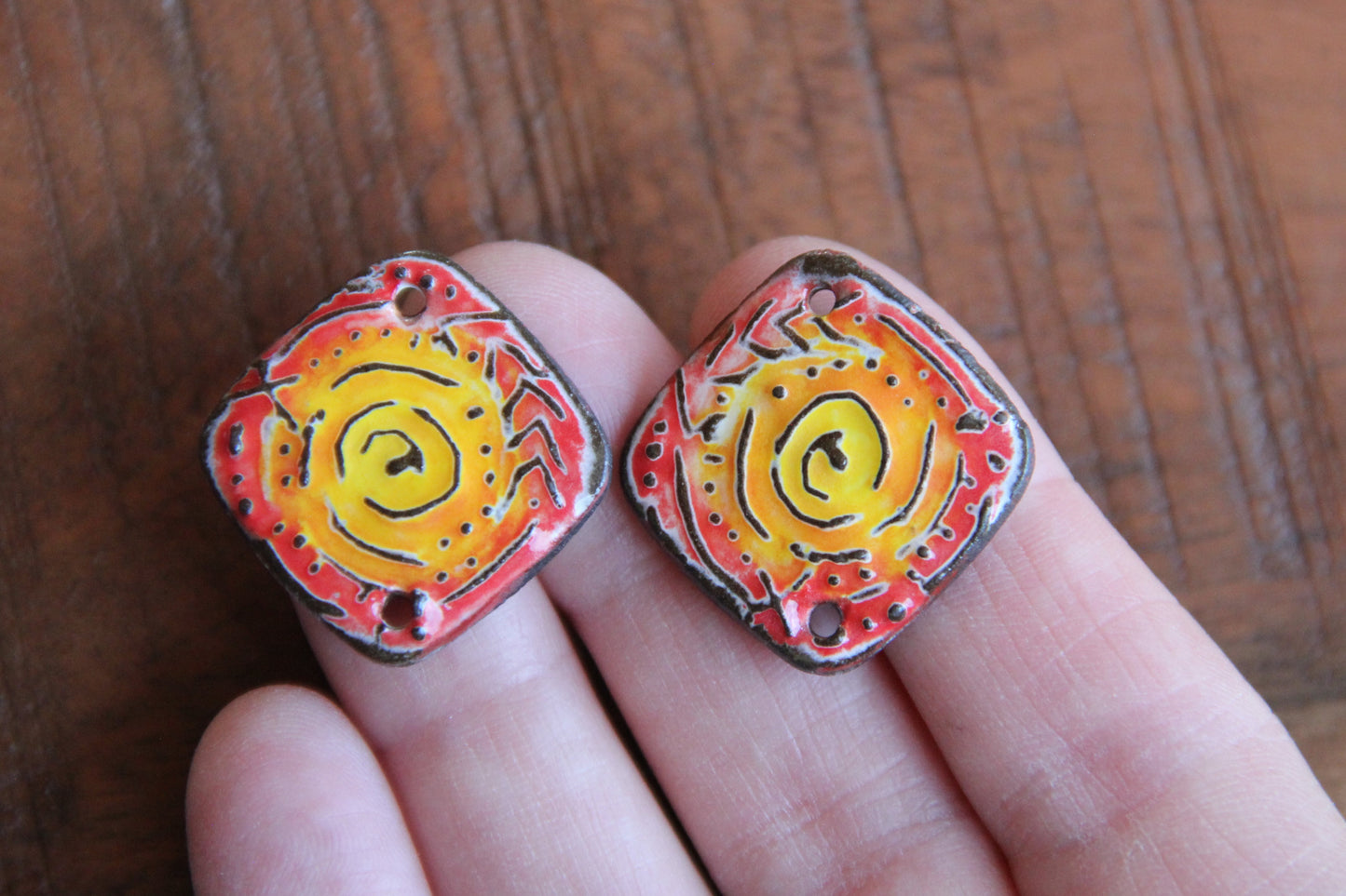 A pair of ceramic CONNECTORS
