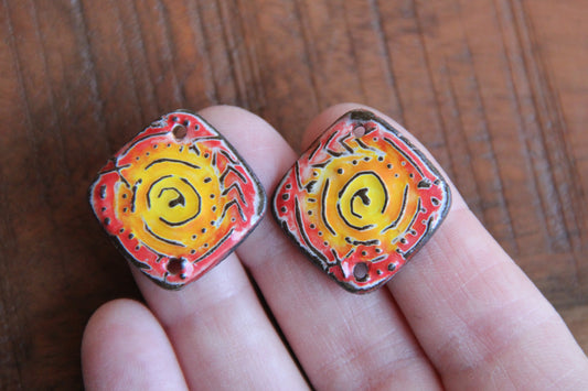 A pair of ceramic CONNECTORS