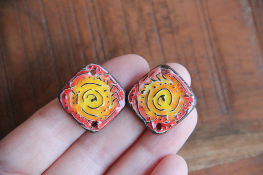 A pair of ceramic CONNECTORS