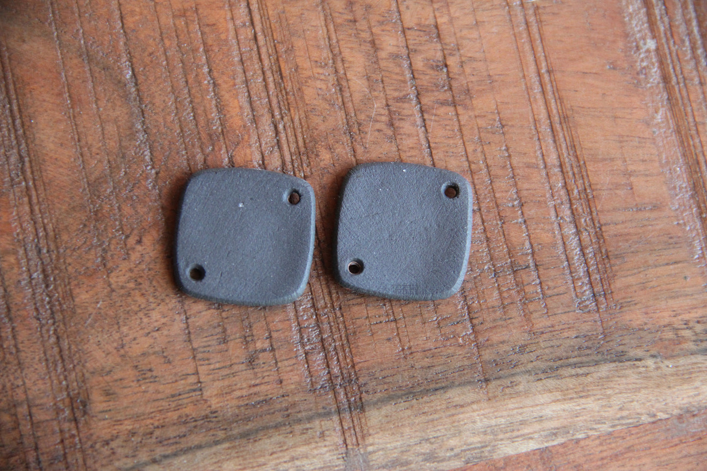 A pair of ceramic CONNECTORS