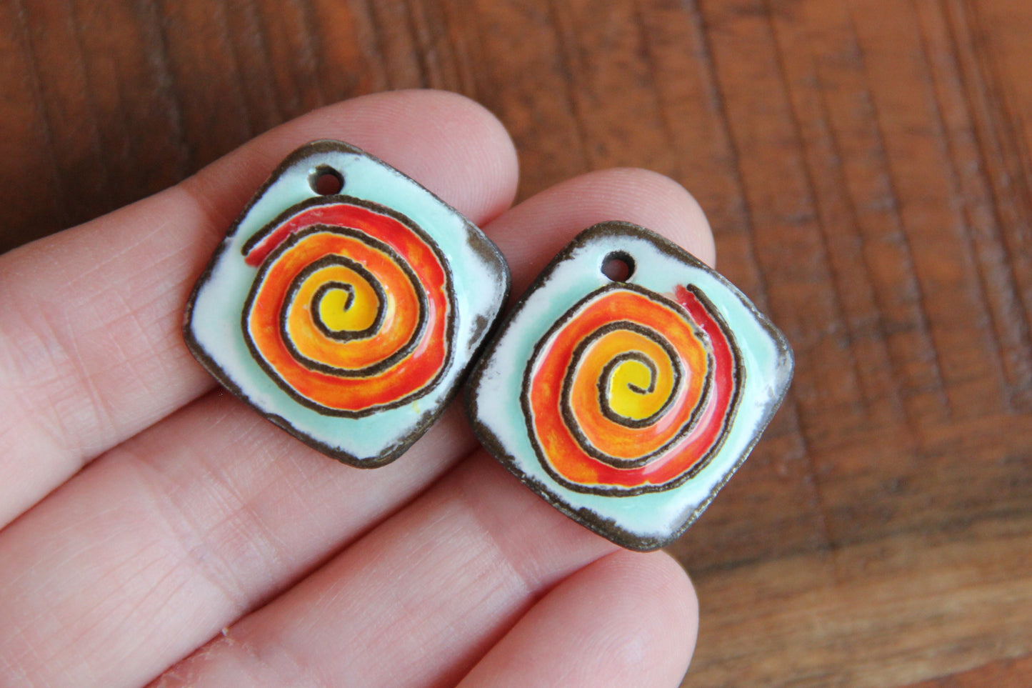 A pair of SPIRAL ceramic earring dangles